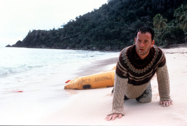 Tom Hanks washed up on the beach of an island in a scene from the film Cast Away