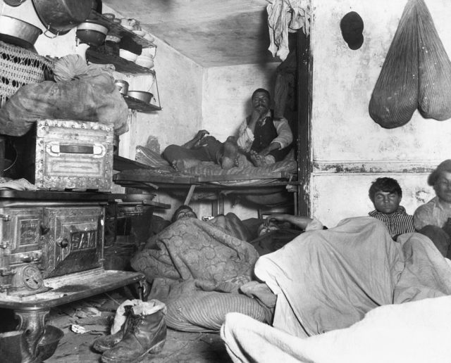 An entire family in a cramped tenement apartment