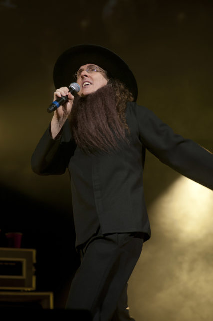 Weird Al Yankovic on stage in an Amish costume