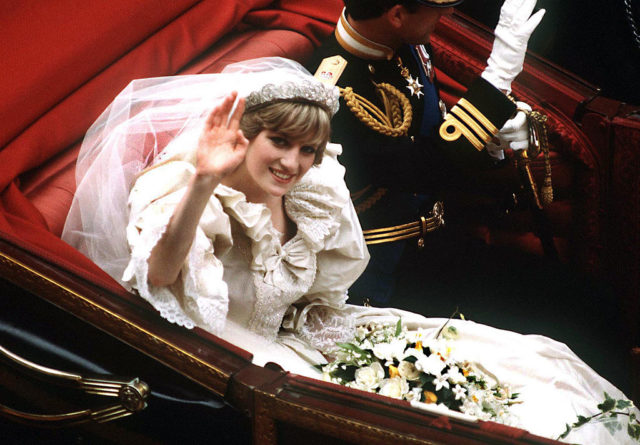 Princess Diana waves to the crowds after her wedding ceremony