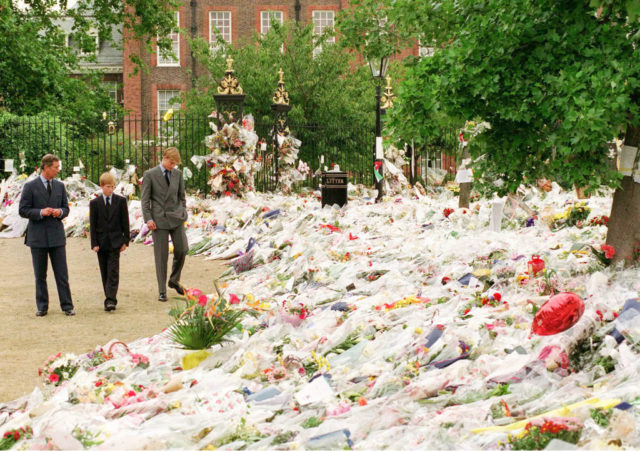 Prince Charles, Prince William and Prince Harry view flowers left in Diana's memory at Kensington Palace