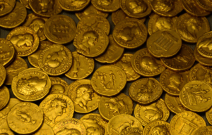 gold coins laying flat on the ground