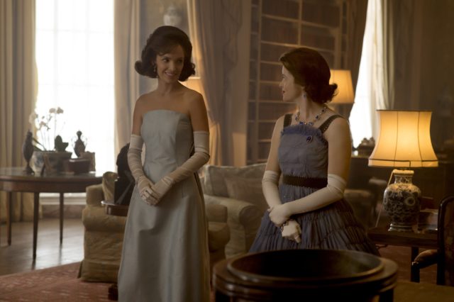 Claire Foy as the Queen in a blue frilly dress, and Jodi Balfour as Jackie Kennedy in an elegant blue gown.