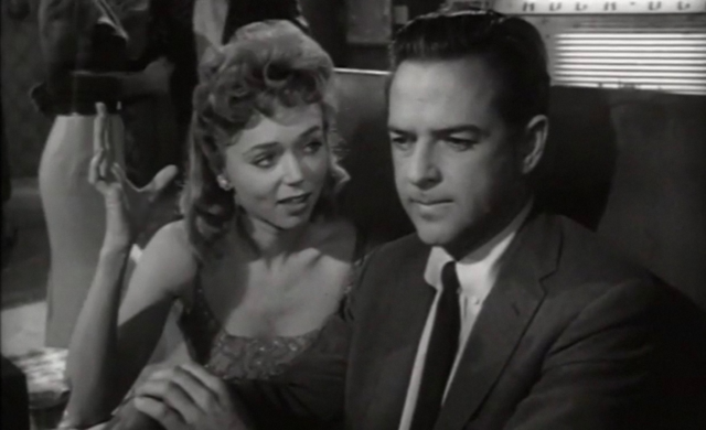 Yvette Vickers and William Hudson sitting in a booth