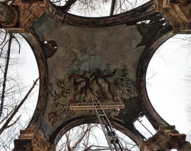 The cross and shelter of the old St Mary's altar covered in grafitti