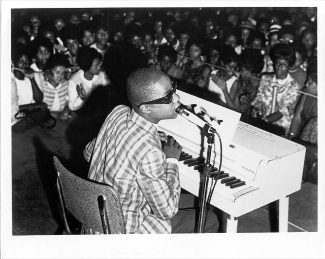 Stevie Wonder plays piano on stage