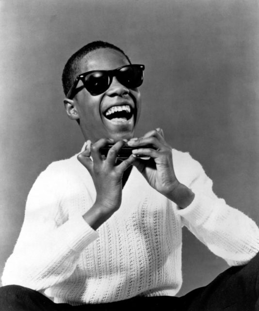 Stevie Wonder with harmonica 