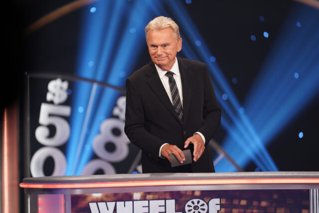 Pat Sajak hosting a celebrity tournament episode of 'Wheel of Fortune'