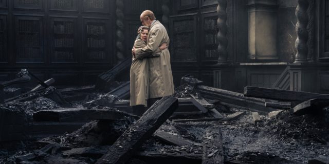 Imelda Staunton and Jonathan Pryce hug in the burned Windsor Castle in "The Crown."