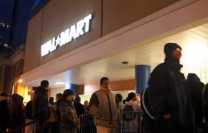 Before dawn, shoppers wait to get into Wal-Mart