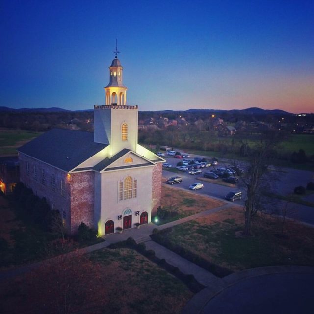 Aerial view of the Remnant Fellowship Church at dusk.