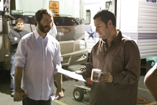 Judd Apatow talking to Adam Sandler somewhere behind the scenes of filming