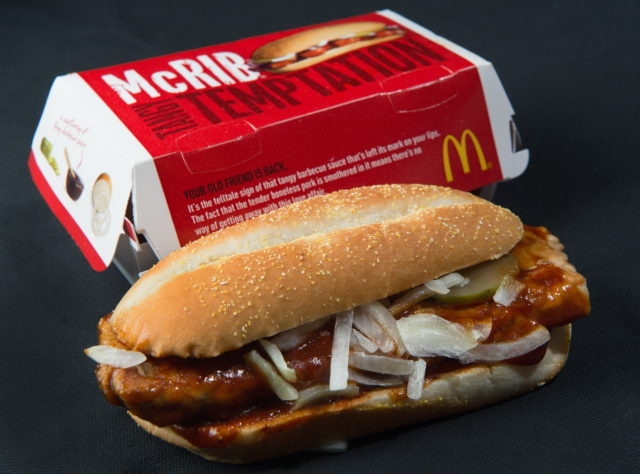McDonald's McRib sitting in front of its packaging