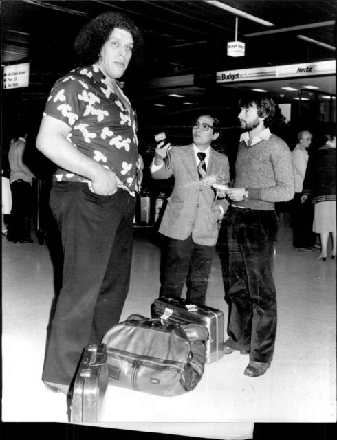 Andre visiting with tourists at the airport