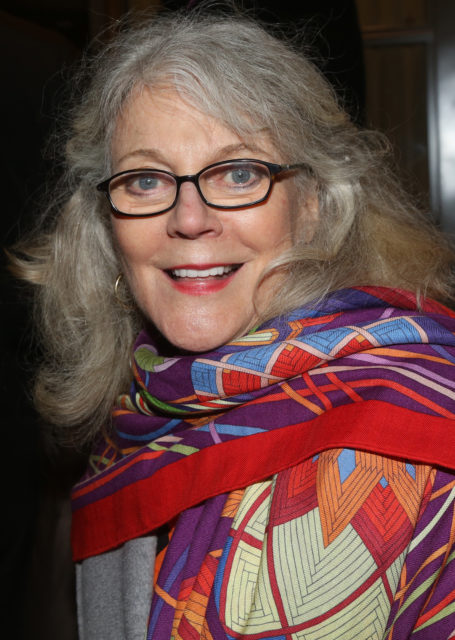 Headshot of Blythe Danner in a scarf and glasses