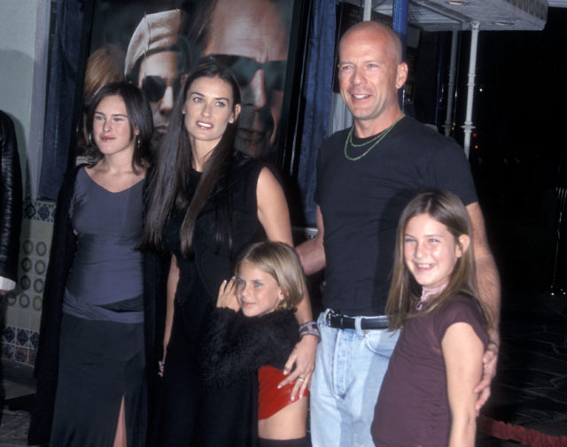 Bruce Willis and Demi Moore posing for a photo with their three daughters, Rumer, Scout, and Tallulah