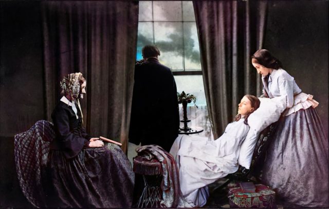 A family watches over a young girl on her death bed