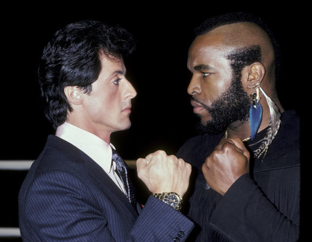 Sylvester Stallone and Mr. T face off at a Rocky III press conference. 