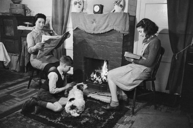 family gathered in front of the fire