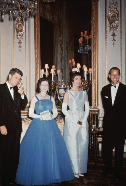 John F. Kennedy, Queen Elizabeth II, Jackie Kennedy, and Prince Phillip standing beside each other