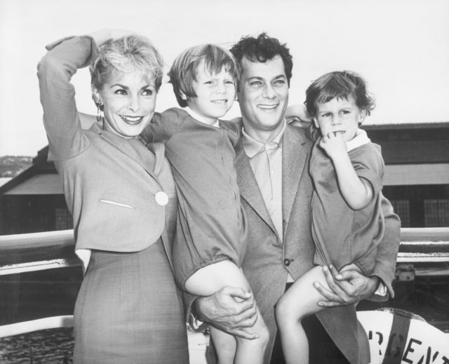 Janet Leigh and Tony Curtis standing with their children, Kelly and Jamie