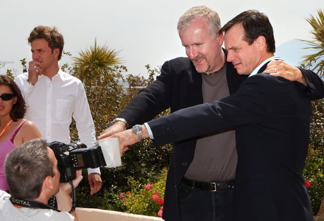 James Cameron and Bill Paxton looking at a cameraman pointing