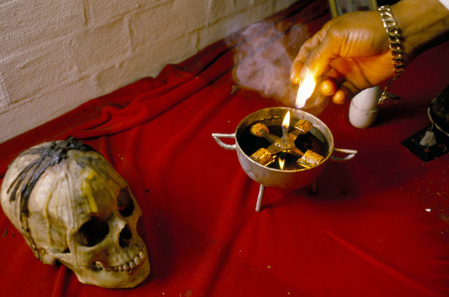 A skull and candle in a voodoo shop