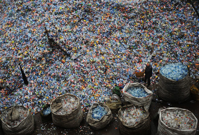 Piles of plastic bottles in a plastics recycling plant in China