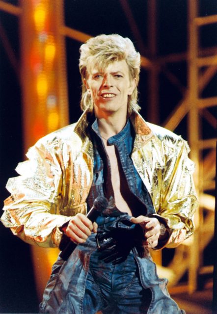 Headshot of David Bowie performing on stage