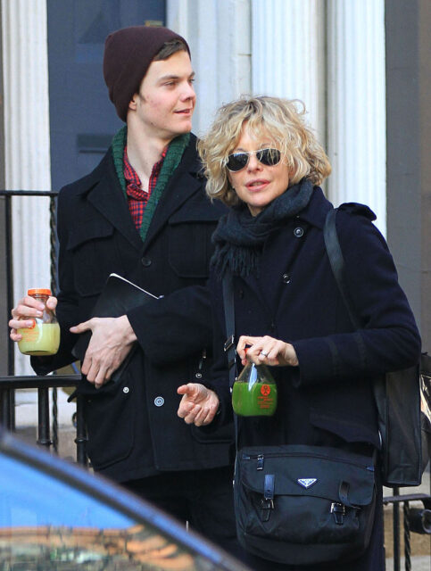 Jack Quaid and Meg Ryan walking along a street