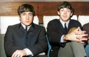 Headshot of John Lennon and Paul McCartney sitting side-by-side