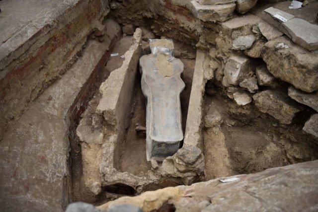 Lead sarcophagus in an excavation hole