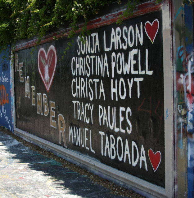 a memorial wall painted with the names of Rolling's Gainesville victims
