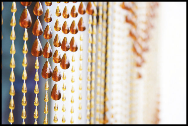 Up close image of a beaded curtain