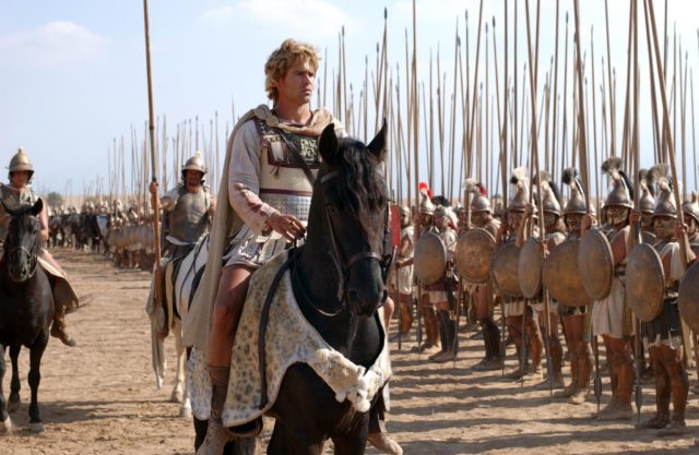 Colin Farrell as Alexander riding a large black horse.