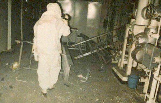 A man searches the Tokai Nuclear Plant after the 1997 explosion and nuclear accident. 