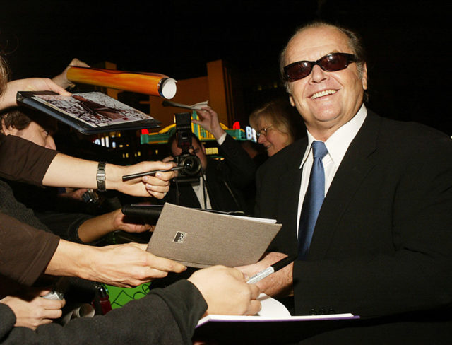 Jack Nicholson signs autographs