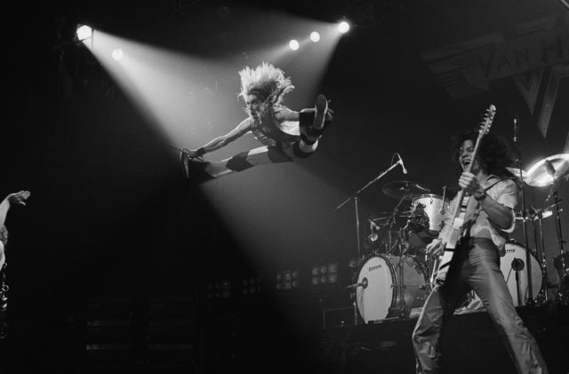 David Lee Roth jumping in mid-air during a performance