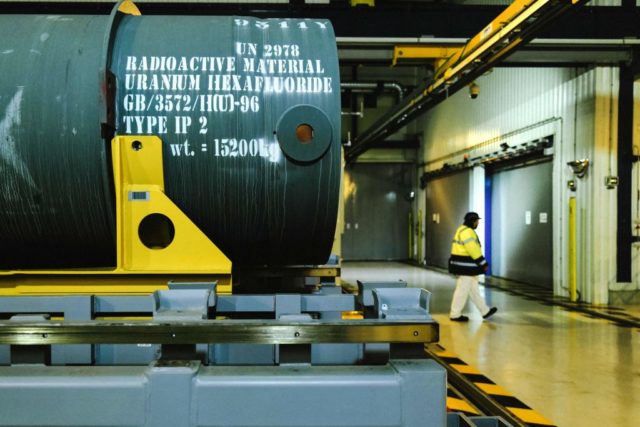 A large tank reads "radioactive material, uranium hexafluoride"