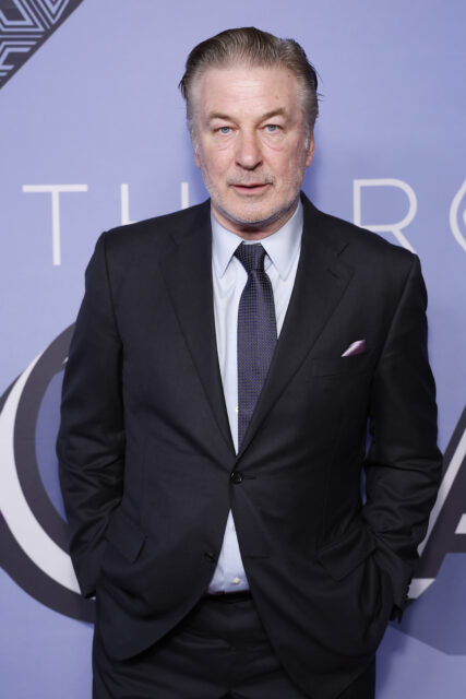 Alec Baldwin posing on a red carpet