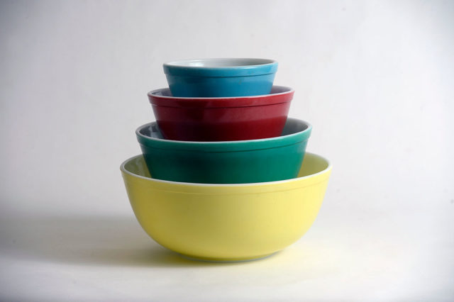 Bowls of many colored stacked in each other. 