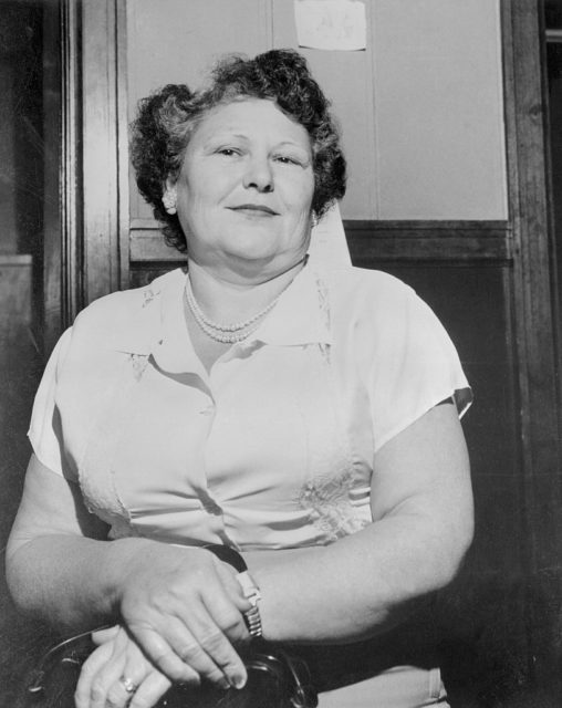 Nannie Doss in a collared t-shirt looking at the camera.