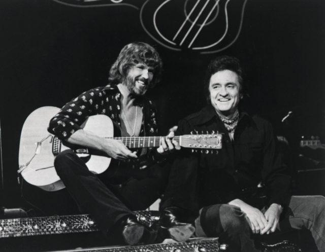 Kris Kristofferson and Johnny Cash sitting together