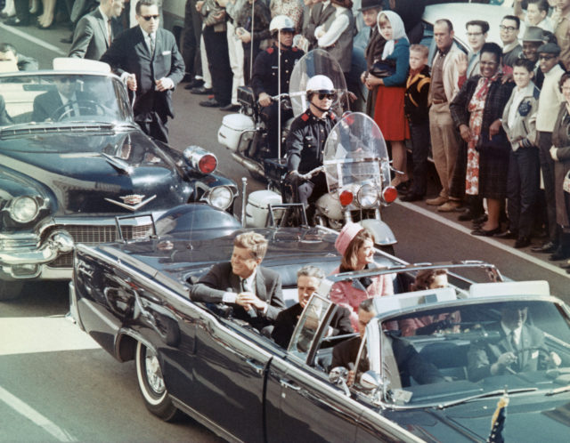 John and Jackie Kennedy, as well as others, in the car on the day of his assassination.
