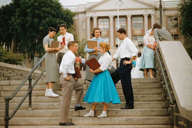 High school students standing together on a flight of outdoor stairs