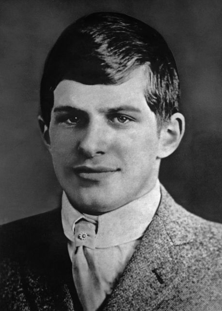 William James Sidis, known as the 'smartest person ever,' posing for a portrait in a wool jacket and white shirt.
