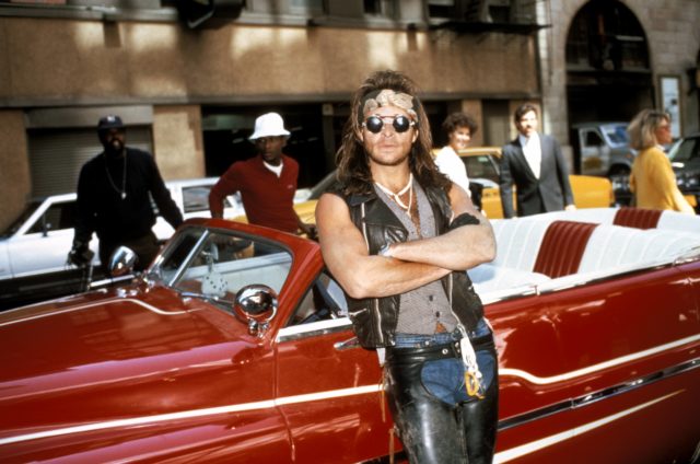 David Lee Roth leaning against his convertible