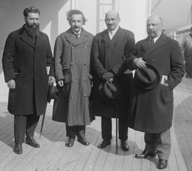 Mossessohn, Chaim Weizman, Albert Einstein, Ussischkin, all standing with each other wearing coats and holding their hats