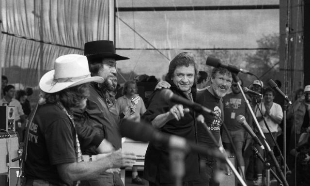 Willie Nelson, Waylon Jennings, Johnny Cash and Kris Kristofferson performing on stage