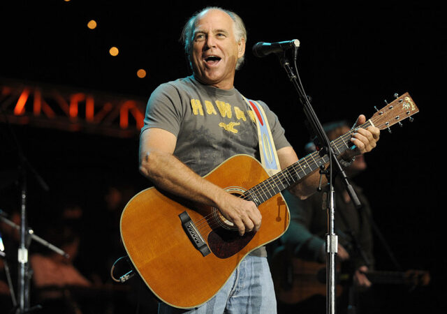 Jimmy Buffett performing on stage